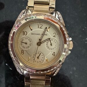 Michael lots gold watch